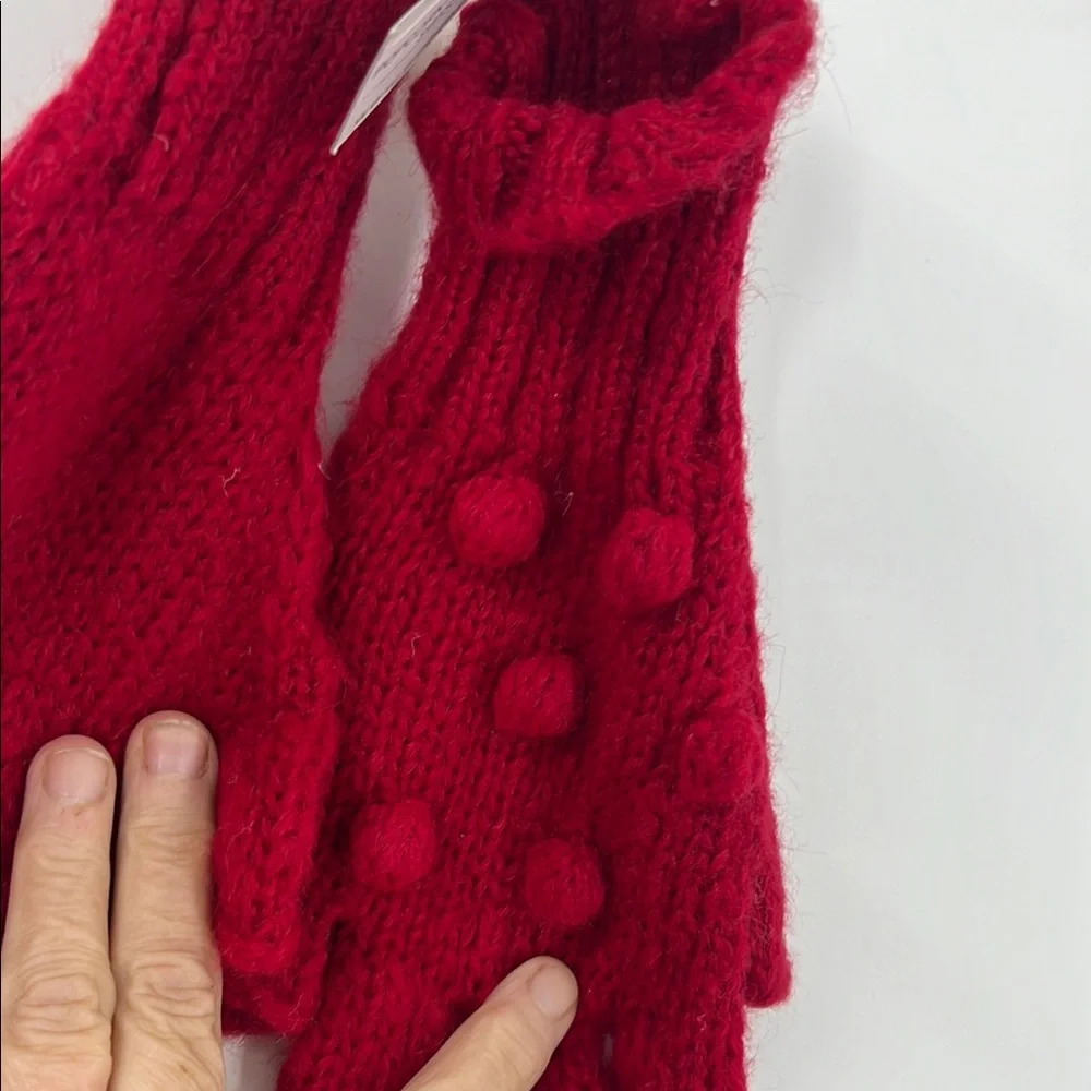 Wooden ships popcorn, fingerless glove with red raised Swiss dot bobble